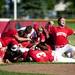 The Bedford team celebrates after a walk off hit to beat Saline on Monday, June 3. Daniel Brenner I AnnArbor.com